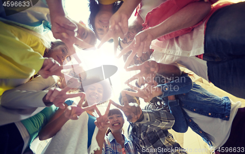 Image of international students showing peace or v sign