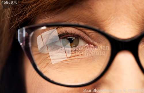 Image of close up of face of senior woman in glasses