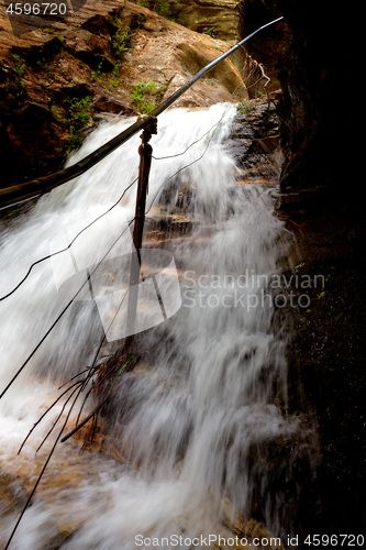 Image of Waterfall overflowing onto the cliff side steps