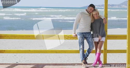 Image of Couple chating and having fun at beach bar