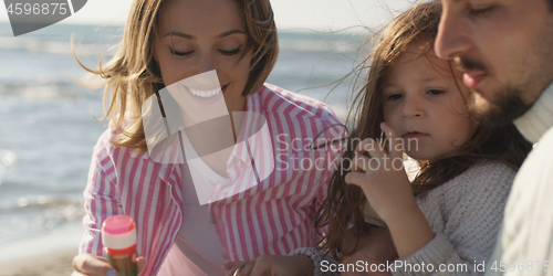 Image of Young family enjoying vecation during autumn