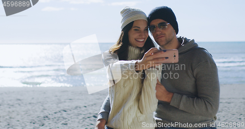 Image of Gorgeous couple taking picture of herselfe