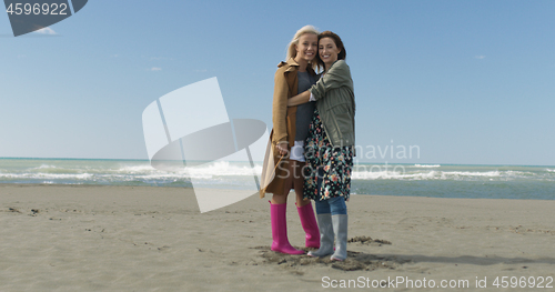 Image of Women Smiling And Enjoying Life at Beach