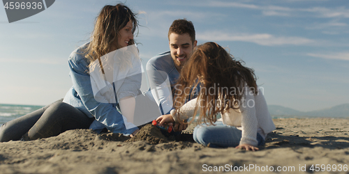 Image of Young family enjoying vecation during autumn