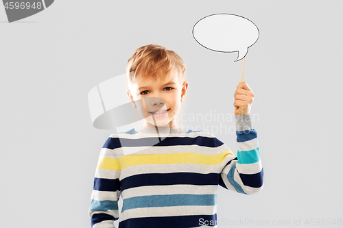 Image of smiling boy holding blank speech bubble