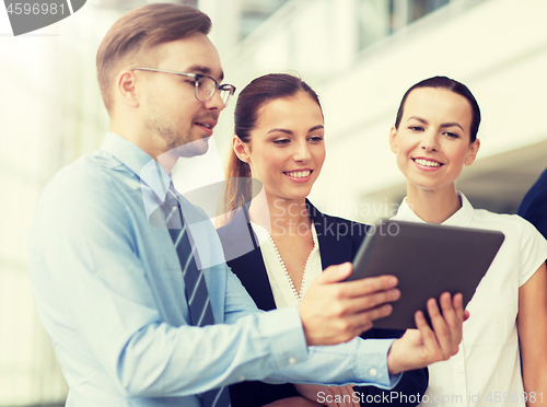 Image of business people with tablet pc computer at office