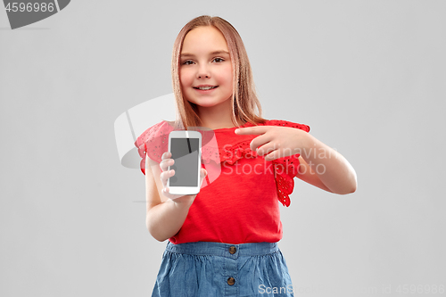 Image of beautiful smiling girl showing smartphone