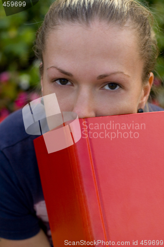 Image of woman with red book