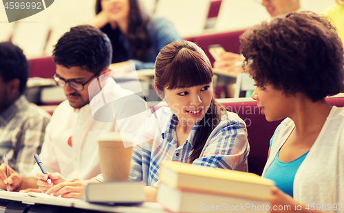 Image of group of international students talking on lecture