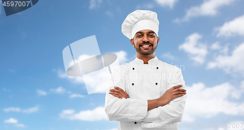 Image of happy male indian chef in toque