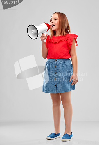 Image of smiling girl speaking to megaphone