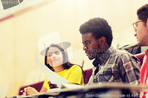 Image of international students with test on lecture