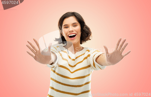 Image of happy woman showing ten fingers of two hands