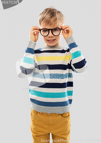 Image of smiling boy in glasses and striped pullover