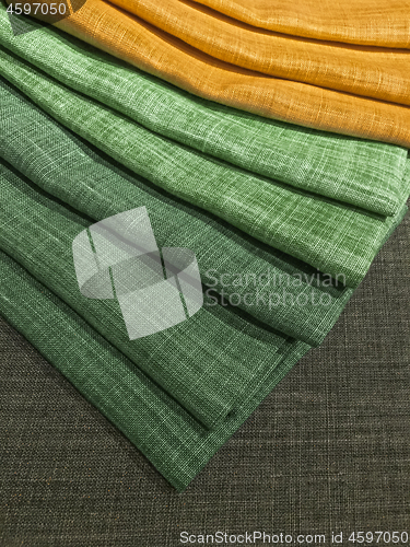 Image of Choice of green and yellow textiles