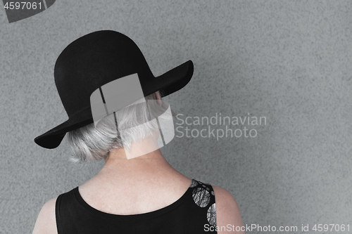 Image of Lady with gray hair in black hat