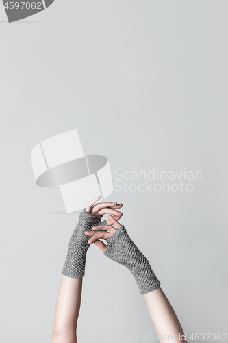 Image of Elegant hands in knitted gloves