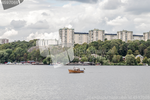 Image of Modern city on a green riverside