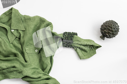 Image of Green shirt and metal artichoke