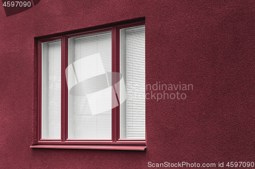 Image of Window of a cherry red building