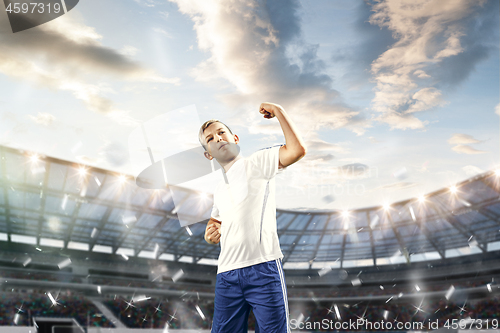 Image of Young boy as winner at stadium