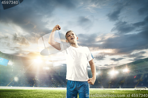 Image of Young boy as winner at stadium