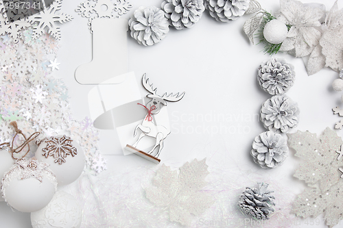 Image of Christmas decorative composition of toys on a white background surrealism. Top view