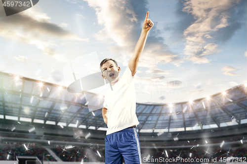 Image of Young boy as winner at stadium