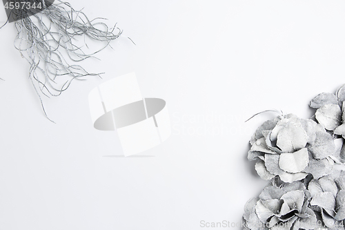 Image of Christmas decorative composition of toys on a white background surrealism. Top view