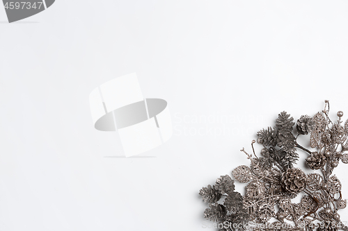 Image of Christmas decorative composition of toys on a white background surrealism. Top view