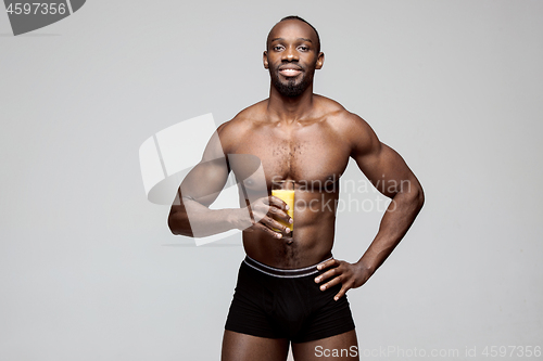 Image of Fit young man with beautiful torso isolated on white background