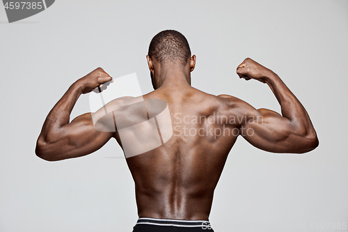 Image of Fit young man with beautiful torso isolated on white background