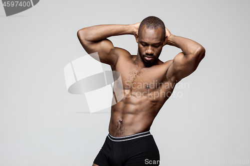 Image of Fit young man with beautiful torso isolated on white background