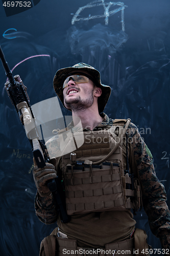 Image of soldier potrait closeup in front of black chalkboard