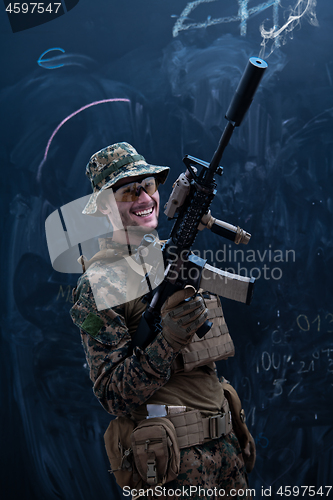 Image of soldier firing into the air in front of black chalkboard