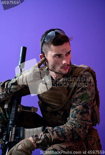 Image of soldier  checking communication