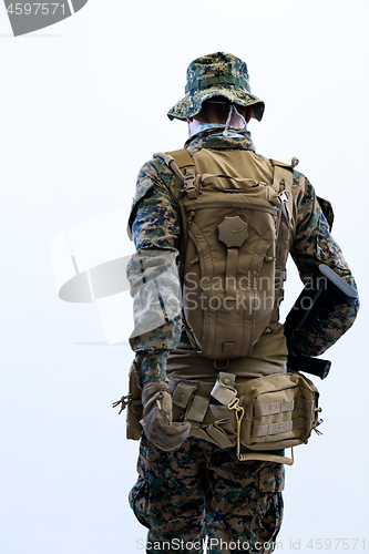 Image of soldier going in battle rear view