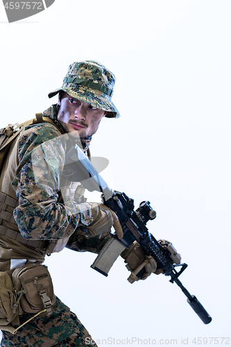 Image of soldier in action aiming laseer sight optics