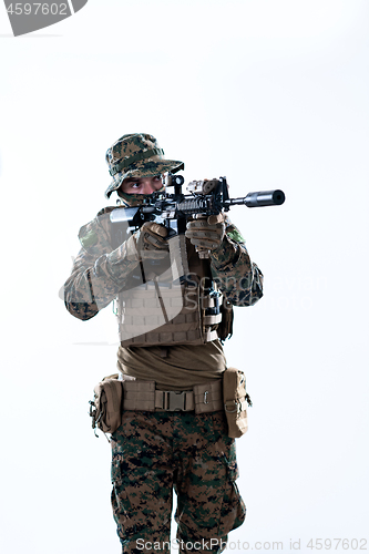 Image of soldier in action aiming laseer sight optics