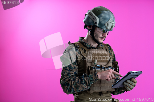 Image of soldier using tablet computer closeup