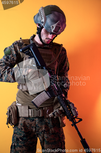 Image of modern soldier against yellow background