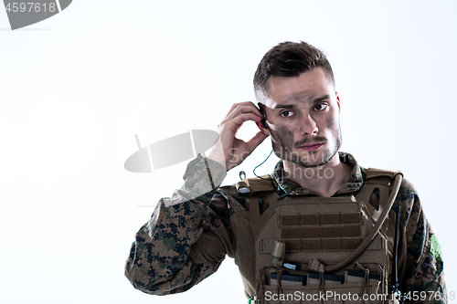 Image of soldier preparing gear for action