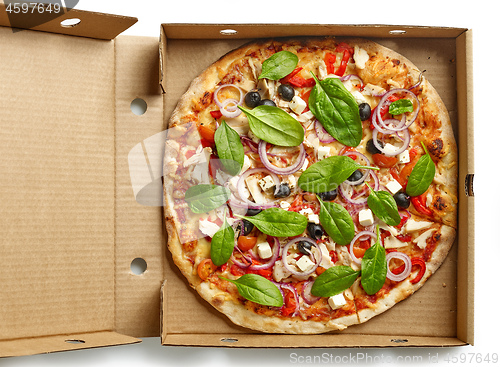 Image of freshly baked pizza in paper box