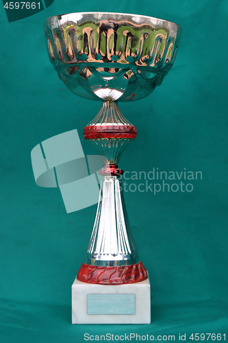 Image of Champion cup with reflection on green background