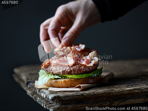 Image of chef making burger