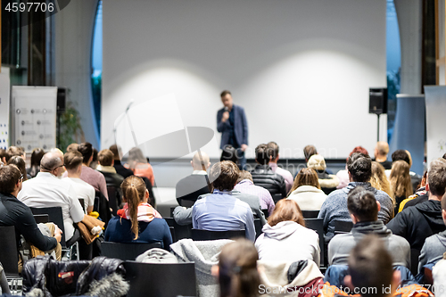 Image of Business speaker giving a talk at business conference event.