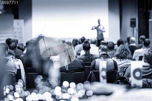 Image of Male public peaker giving presentation on business conference event.