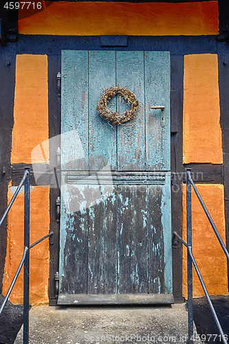 Image of Blue door entrance on a retro facade