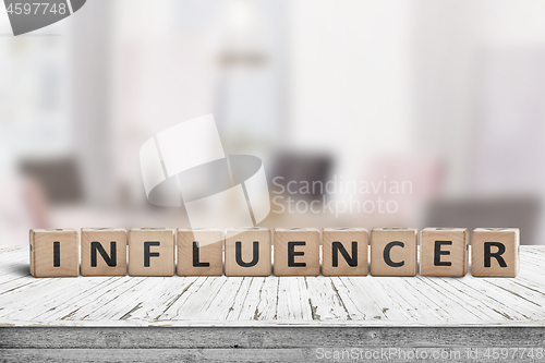 Image of Influencer sign on a wooden table