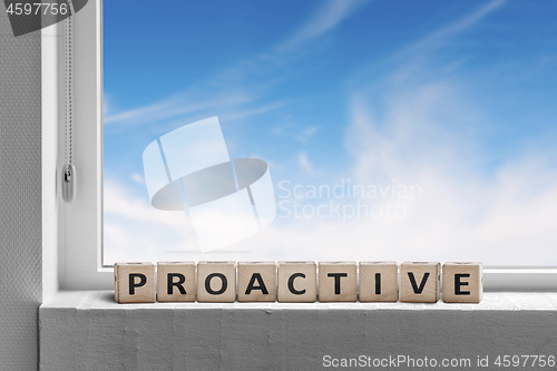 Image of Proactive sign in a window sill on a bright day